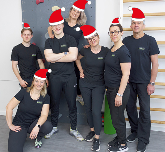 Team mit Weihnachtsmützen